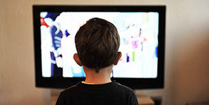 Kid in front of TV