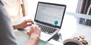 Man do market research on his computer